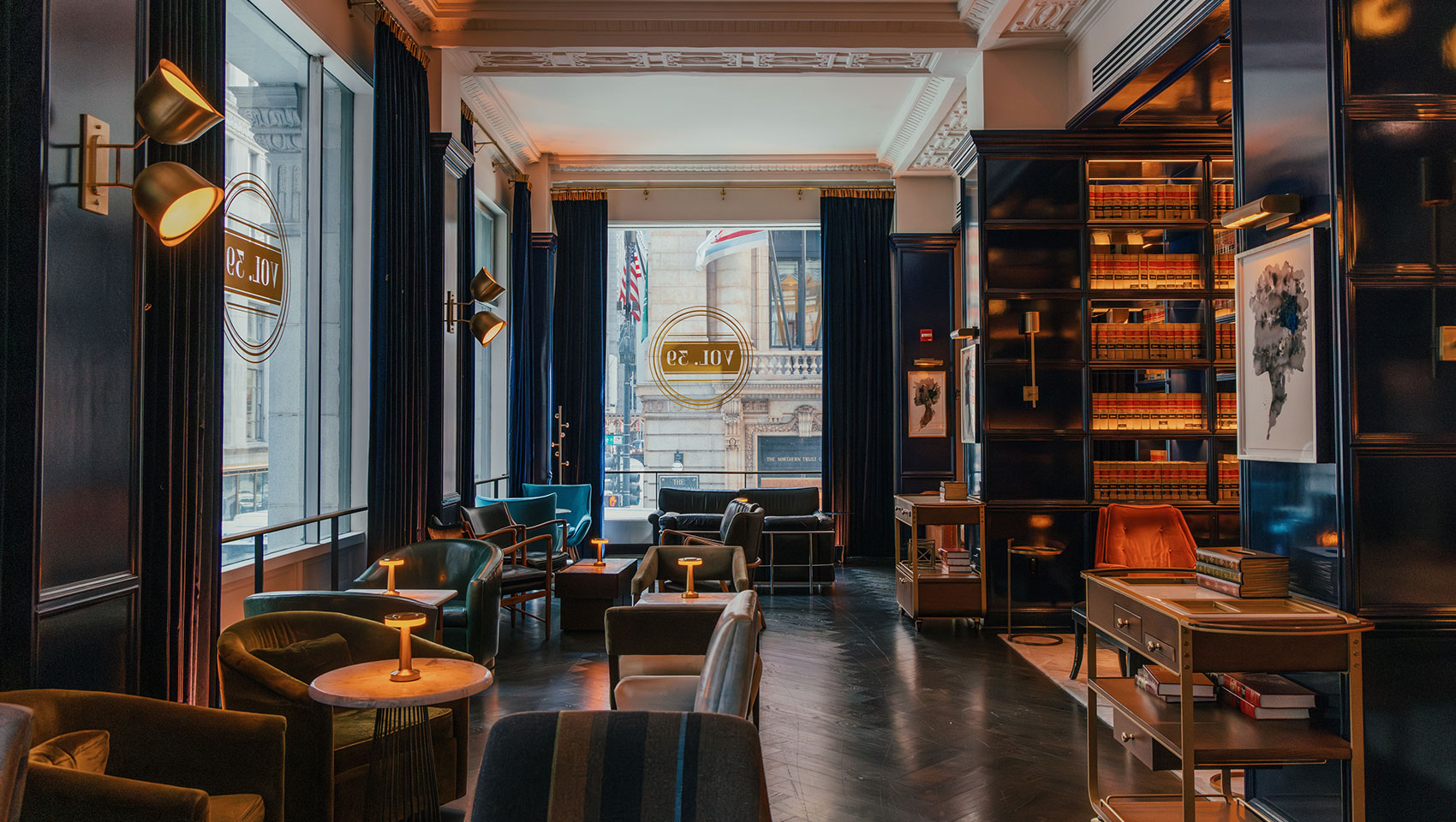 lounge seat with library shelves and windows at Vol 39