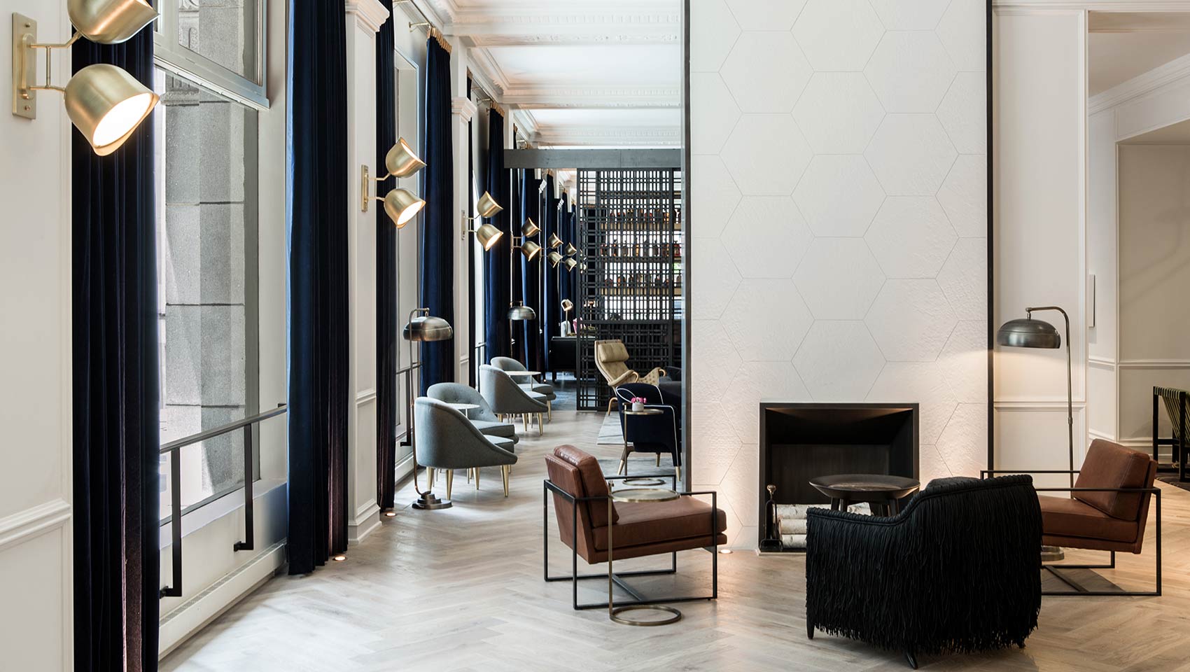 Kimpton Gray Hotel Chicago lobby living room, view of fireplace and seating