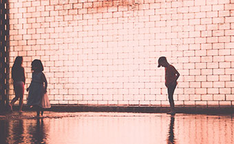child in front of art installation